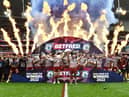 The Wigan Warriors players celebrate winning the Challenge Cup