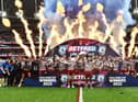 The Wigan Warriors players celebrate winning the Challenge Cup
