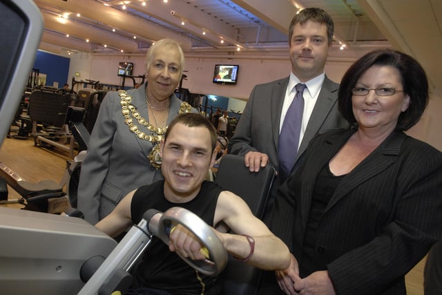 Shaun Fallowes, a volunteer from Age UK, is using an upper body bike in a sponsored gym-based cycle to cover 526 miles - the distance between Wigan and Angers. Pictured with Shaun are Mayor of Wigan Coun Joy Birch, Matthew Hotershall, chairman of Age UK Wigan Borough, and Sylvia Curtis, service manager for Age UK Wigan Borough