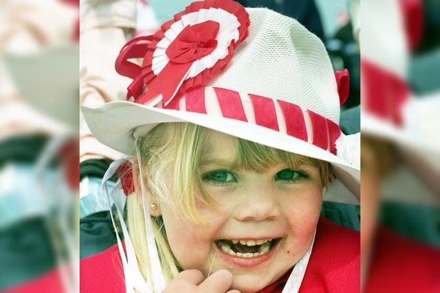 A young Wigan fan wears her happy hat at Wembley.