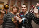 Kim Beardsmore from Age UK Wigan Borough, right, with Kath Lewin, left, from Daisy Chain Stitches,  the group meet every Tuesday afternoon at Clifton Street Community Centre, Poolstock, have been busy making little knitted hats to go on Innocent Smoothie bottles in partnership and raising funds for Age UK, the group have made about 600  so far.
