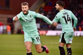 Stephen Humphrys celebrates making up for his earlier penalty miss with Latics' equaliser at Leyton Orient
