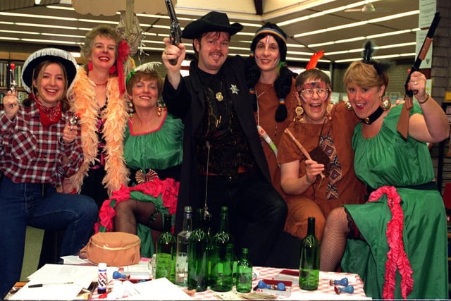 Down at the Shevington Library " Last Chance" Saloon the staff were busy raising cash for " Children in need" they are (left Catherine Grant Linda Lees Sheila Kirk Alan Corden Val Yates Chris Watts and Christine Rawlinson