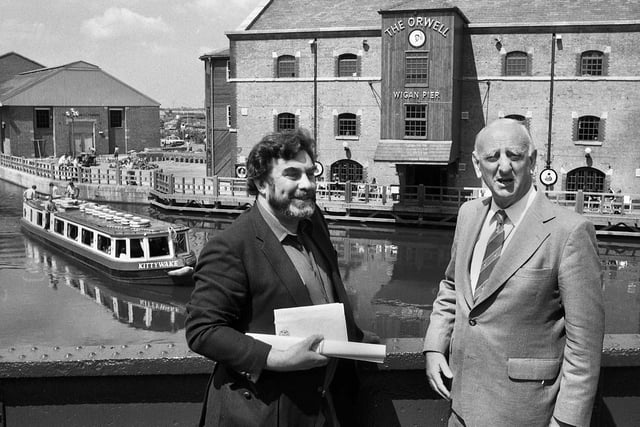 BBC radio presenter Brian Johnson, right, with Wigan Piermaster Peter Lewis at Wigan's famous landmark for a broadcast of the popular Sunday afternoon programme "Down Your Way" in May 1985.