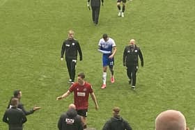 Ashley Fletcher leaves the field with his arm in a sling after playing through the pain  barrier against Millwall