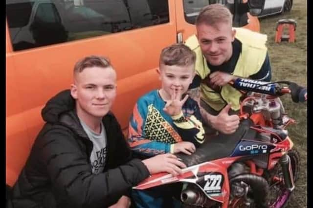 Bailey mitchell (centre), with his uncle Billy Livesley (right), who used to travel around the country to watch his nephew race.