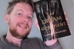 Author Darren Turnerhurst with his book The Dream Merchant