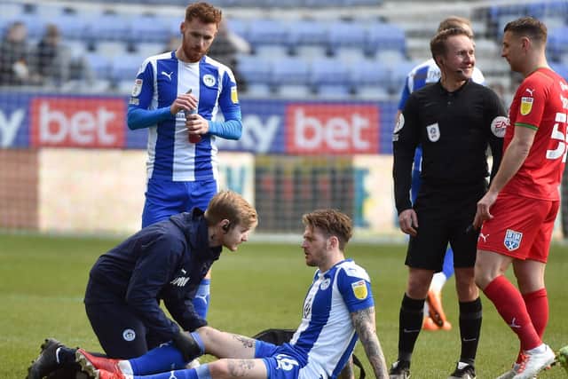 Glen Rea suffers his knee injury against Wimbledon