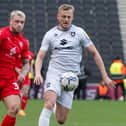 Stephen Humphrys puts pressure on the MK Dons backline