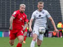 Stephen Humphrys puts pressure on the MK Dons backline