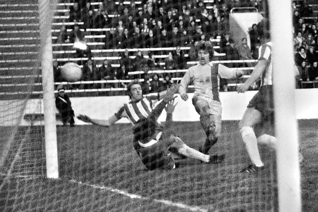 Wigan Athletic striker John Rogers hits the side netting as non-league Latics come close to scoring against 3rd Division Sheffield Wednesday at Hillsborough in the 2nd round of the FA Cup on Saturday 13th of December 1975.  Latics lost 2-0.