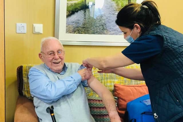 A resident of Ash Tree House care home in Wigan receiving his second coronavirus jab