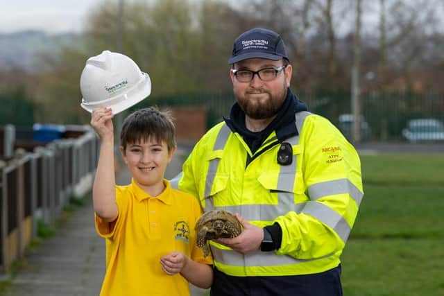 Rescued tortoise "Mary" reunited with its owner, Harvey Dean-Evans from Wigan after being found by ENWL engineer Ben Baxendale