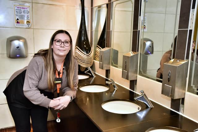 Pub manager Rachael Evans in the ladies toilets in The Thomas Burke, Leigh