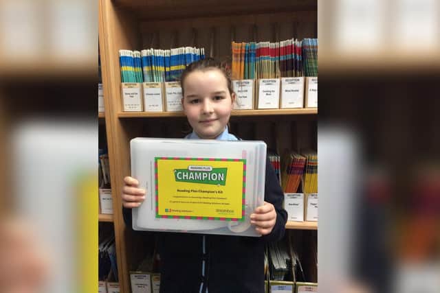 Freya Barlow with her award for reading