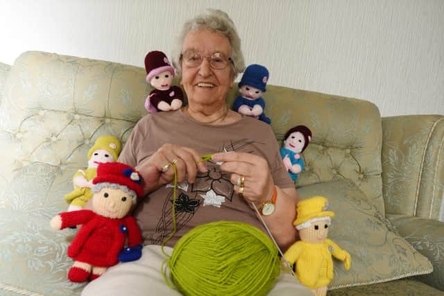Keen knitter Anne Aspinall with some of her creations