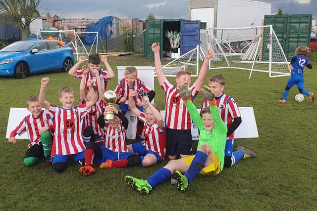 The Pine Villa under-11s side after their cup final victory