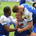 Max Power celebrates scoring his first goal in the Championship to put Latics ahead against QPR