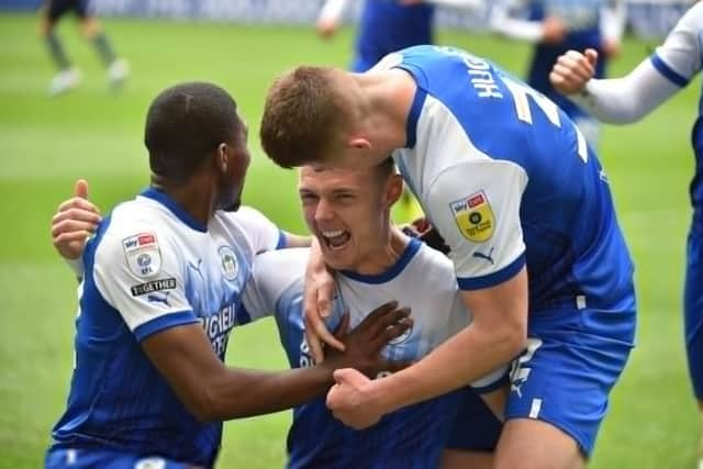 Max Power celebrates scoring his first goal in the Championship to put Latics ahead against QPR