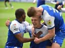 Max Power celebrates scoring his first goal in the Championship to put Latics ahead against QPR