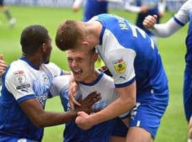 Max Power celebrates scoring his first goal in the Championship to put Latics ahead against QPR
