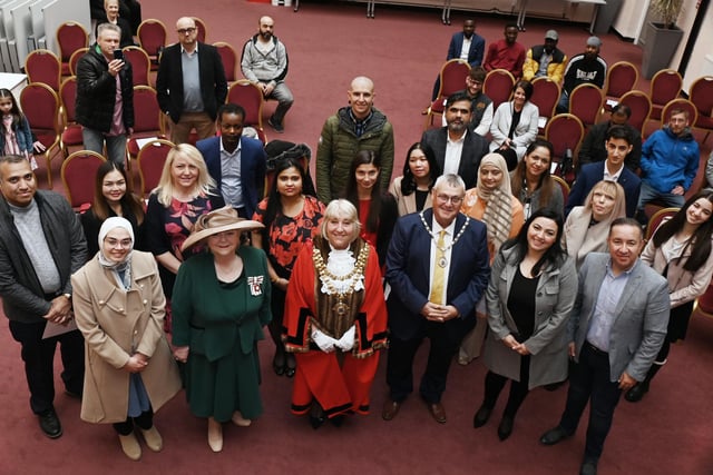 The Mayor of Wigan Coun Marie Morgan, consort Coun Clive Morgan and representing His Majesty The King, Vice Lord-Lieutenant of Greater Manchester Sharman Birtles MBE pictured with new citizens to the borough at the monthly British Citizenship ceremony, held at Wigan Town Hall.
