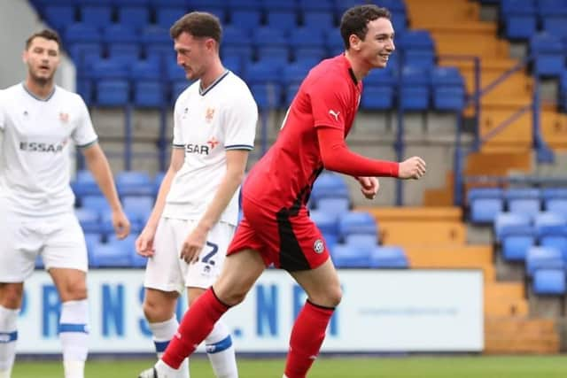 Joe Adams scored a late equaliser for Latics in the 1-1 draw at League Two Tranmere