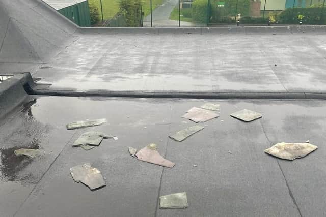 Broken tiles on the roof of Sunshine House