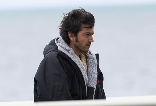 Andor star Diego Luna, who plays Cassian Andor, walks back to his trailer during filming for the Star Wars spin-off in Cleveleys