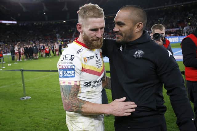 Sam Tomkins with Wigan Warriors assistant coach and former team-mate Thomas Leuluai after the Grand Final