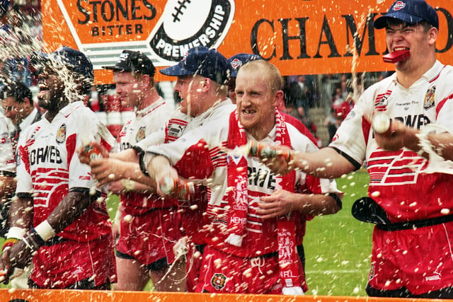 The champagne and beer flow as Wigan players celebrate - Wigan v Leeds