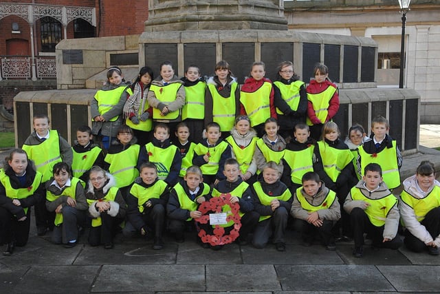 RETRO 2007  Pupils from St Marks school visited the Remembrance memorial outside Wigan Parish Church to hold their own memorial service.