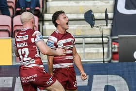 Jai Field of Wigan Warriors celebrates a semi-final try over Hull KR