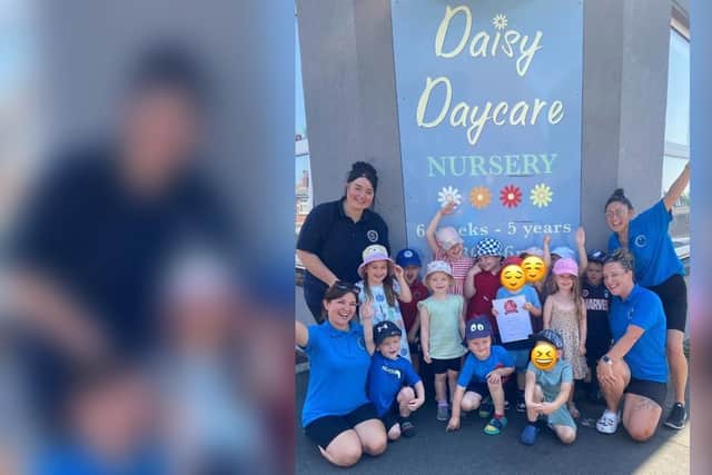 Daisy Daycare Nursery children and staff after receiving their latest award, including (far right) owner/manager Jackie McElhatton