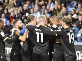 The Latics players enjoy the midweek win at Huddersfield