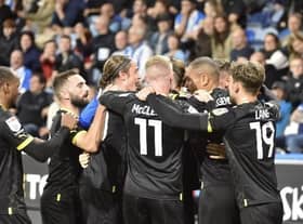 The Latics players enjoy the midweek win at Huddersfield