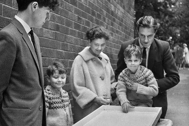 A family trying their luck during the summer fete at Blessed John Rigby Grammar School, Orrell, in the 1960s.