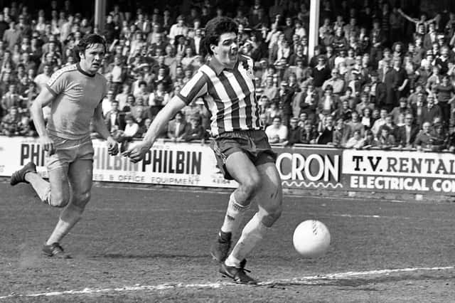 Wigan Athletic striker Mick Quinn scores in the 3-1 defeat of Halifax Town at Springfield Park in the Division 4 fixture on Saturday 12th of April 1980.
Neil Davids and Peter Houghton scored the other goals.