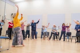 Mel Brierley (in yellow) running a Dance for Parkinson's session