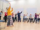 Mel Brierley (in yellow) running a Dance for Parkinson's session