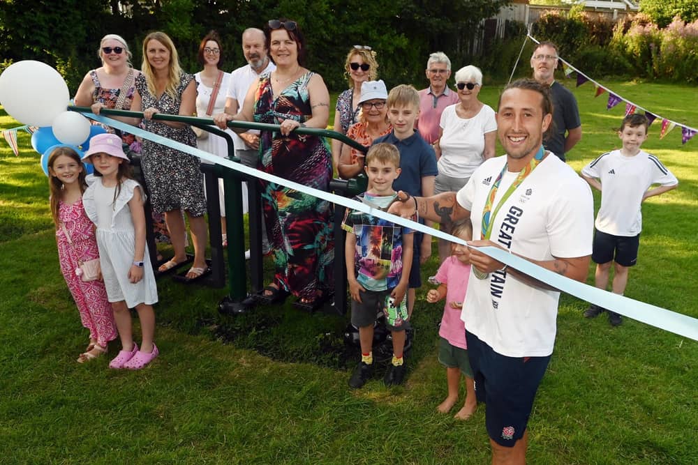 Olympian Dan Bibby, right, from Team GB rugby sevens, officially opens the new outdoor gym equipment at Stockley Park, Appley Bridge, made possible by Friends of Stockley Park