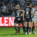 Wigan Warriors and Wakefield Trinity players shake hands after Round 15 clash at the DIY Kitchens Stadium