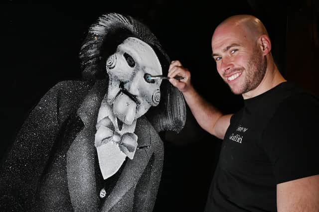 Scott Wilcock of Snow Graffiti, has been travelling around the country creating spooky window displays for Halloween.