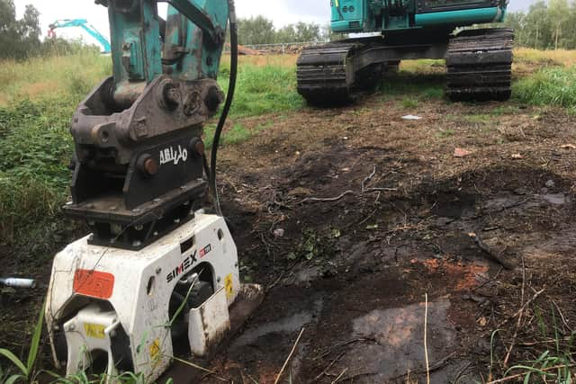 Work being carried out to extinguish an underground fire on Queensway in Leigh