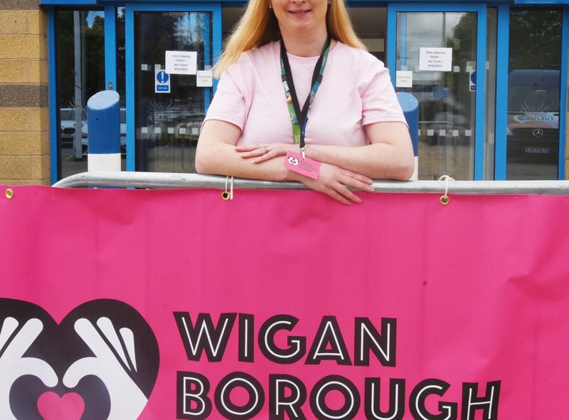 Mary Davies, carer development officer at Wigan Council, welcomes people to the festival