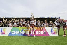 Wigan Warriors Women celebrate winning the Women's Nines trophy after victory over Leeds