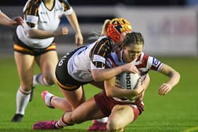 Georgia Wilson goes over for a try