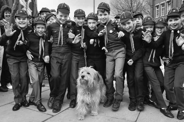 Just walking the dog are the 27th Wigan St. Aidans Cubs with Pip at the annual St. George's Day parade on Sunday 23rd of April 1989.
