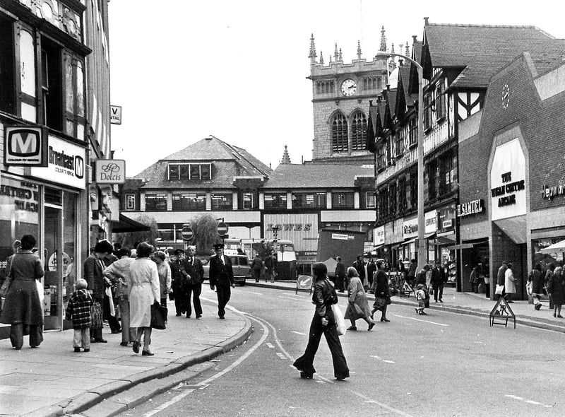 Market Place, Wigan, in the mid 1970s when Lowes store was still in existence and the out of place brick facia of The Wigan Centre Arcade caused controversy.