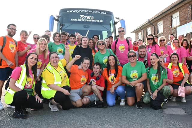 Fund-raisers get ready to board a coach as they prepare a sponsored walk from Halsall to Wigan Pier, to raise funds for Brighter Dayz, Wigan.